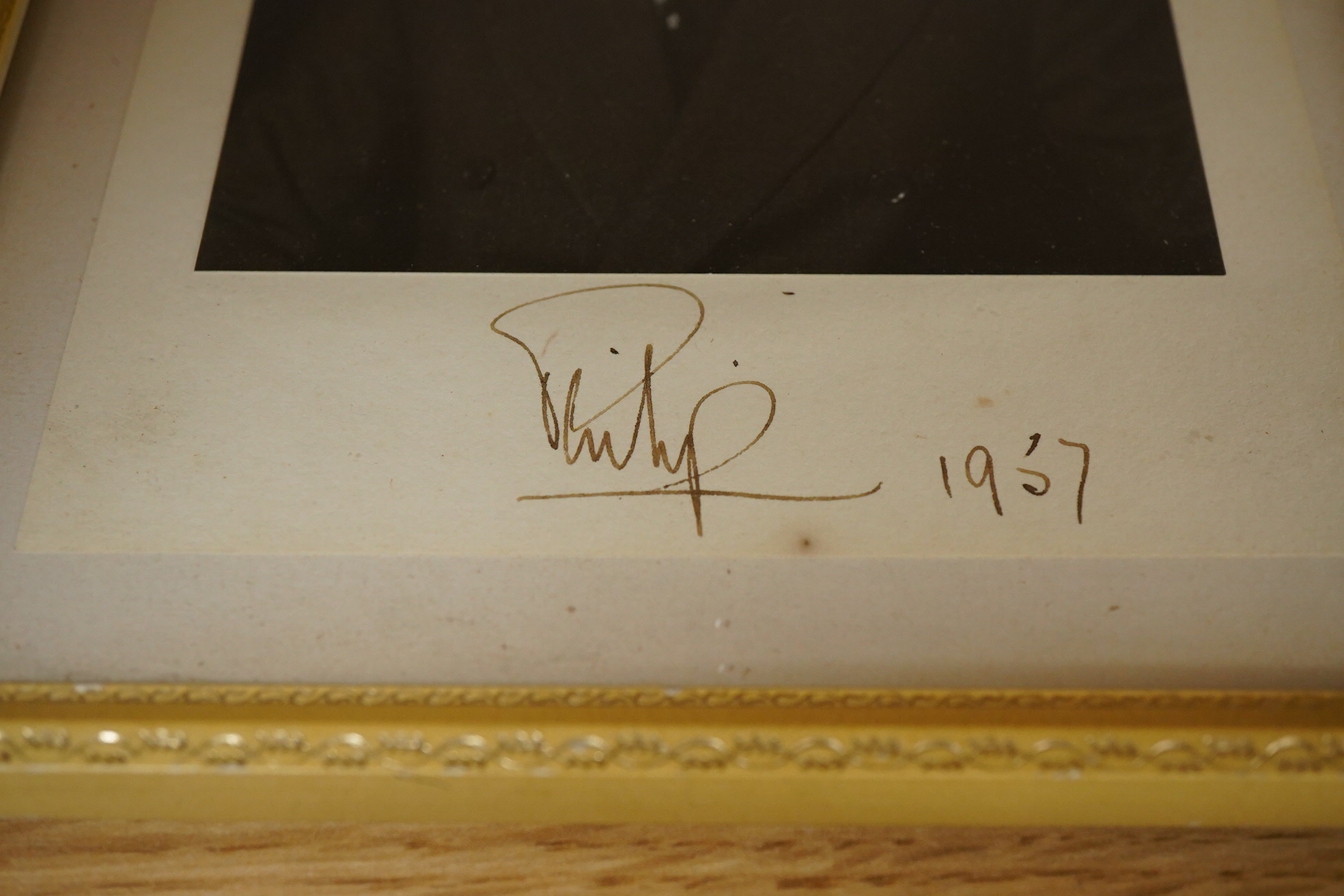 Two autographed photographs of Prince Philip dated 1957, framed